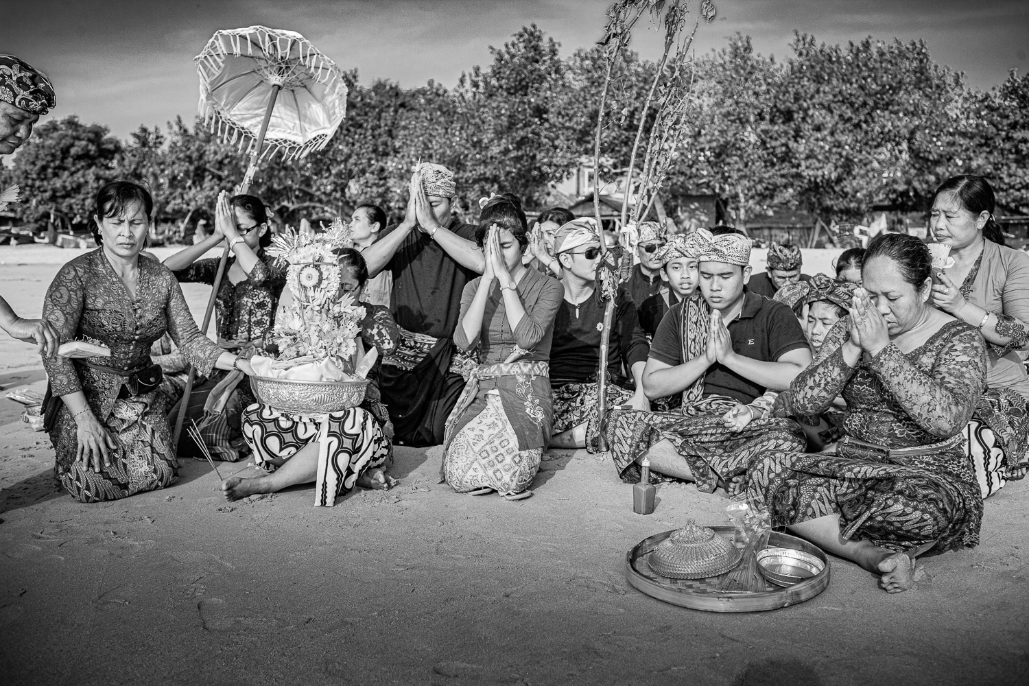 Ngaben cremation in Bali, Mr. A.A. Mangkling’s family members on the beach before releasing his spirit to the sea.
