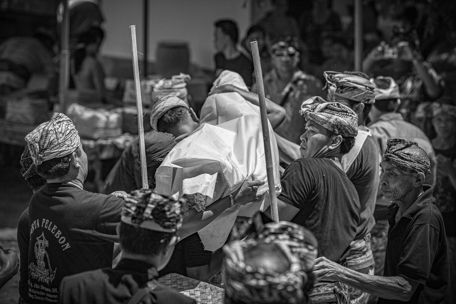 Ngaben cremation in Bali, the body is bought from the families ritual building to be placed on the stretcher for bathing.