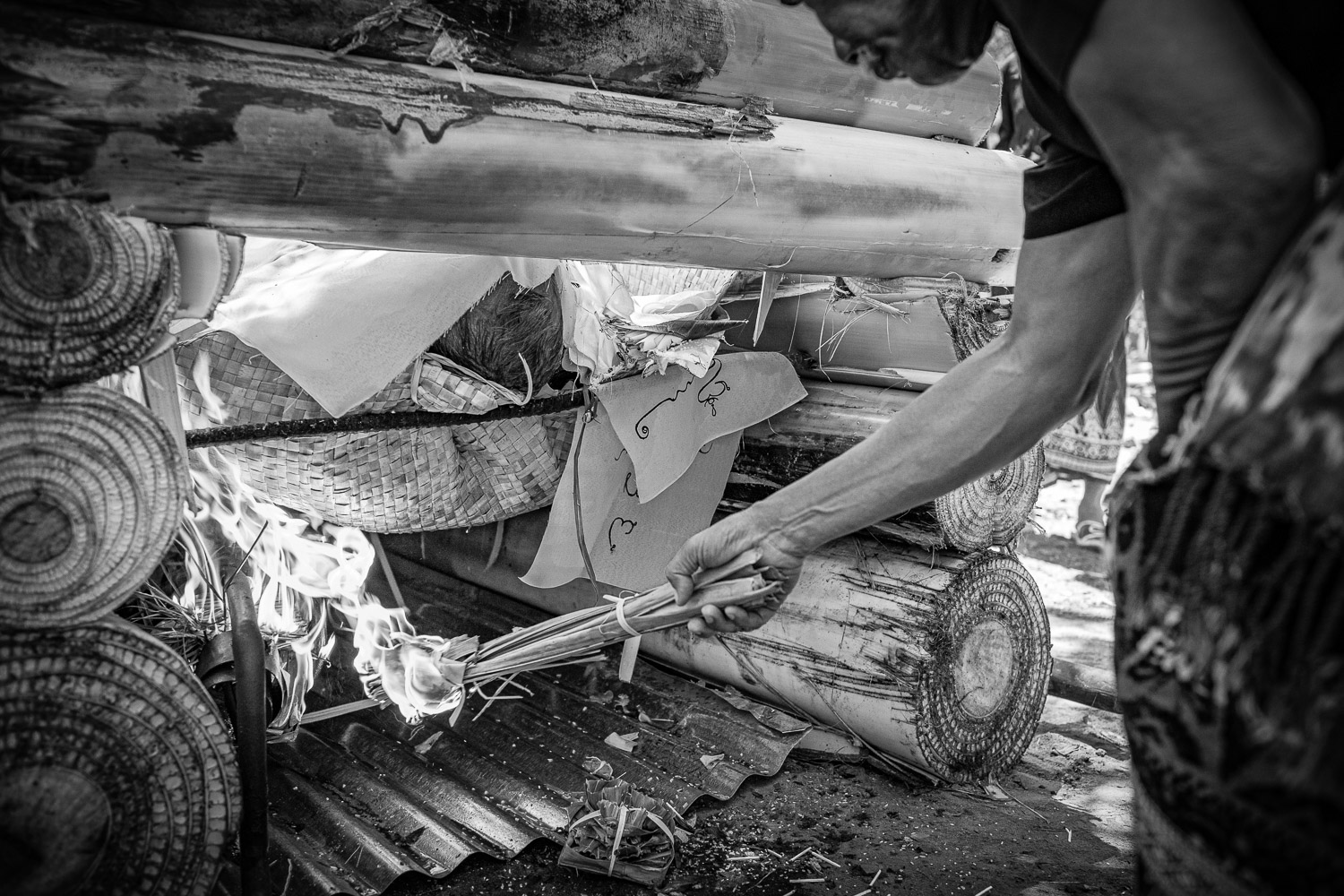 Ngaben cremation in Bali, fires are ignited by a blessed torch and the element ‘fire’ ritual is now underway.