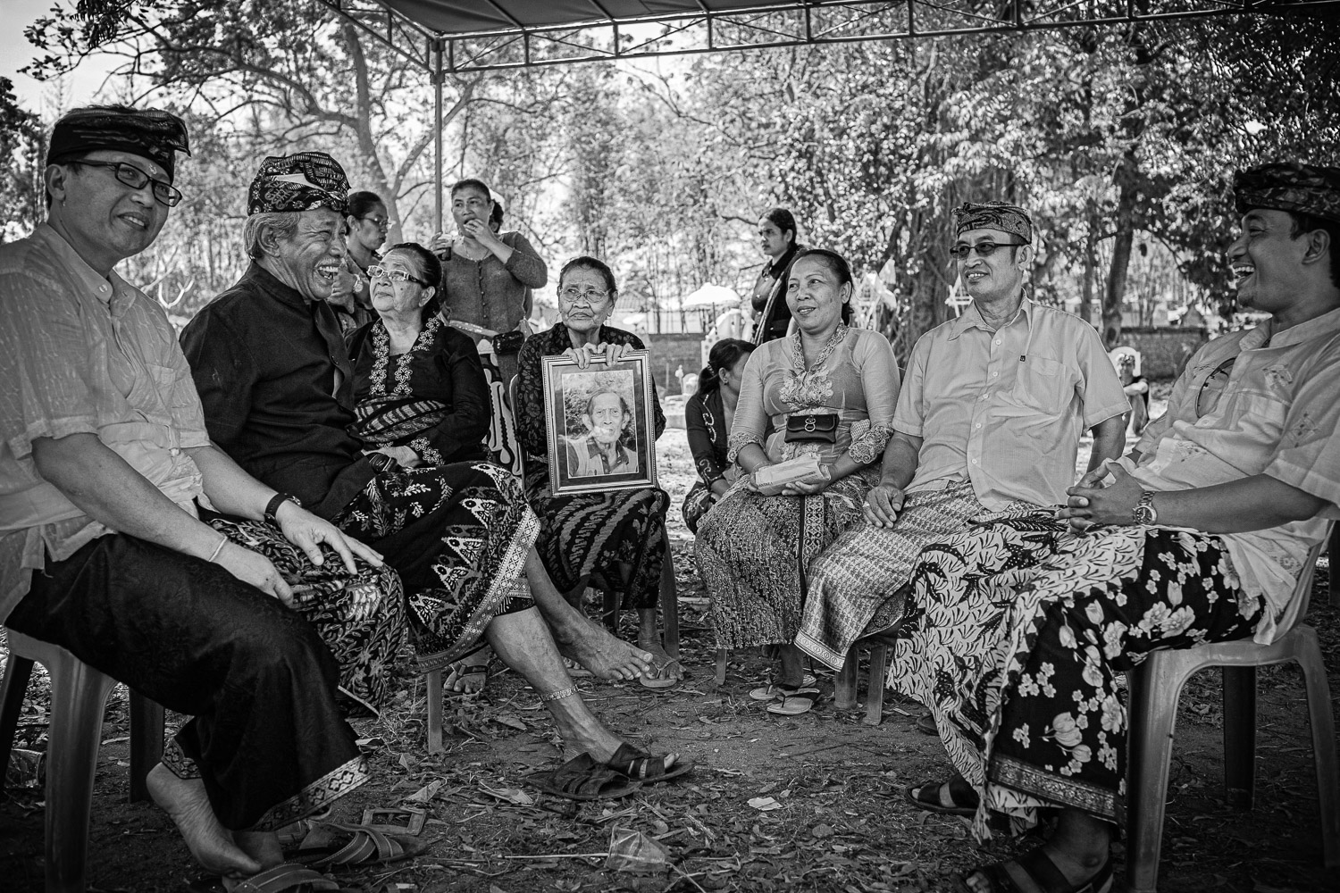 Ngaben cremation in Bali, family gathering at the cremation celebrating the life of the deceased.