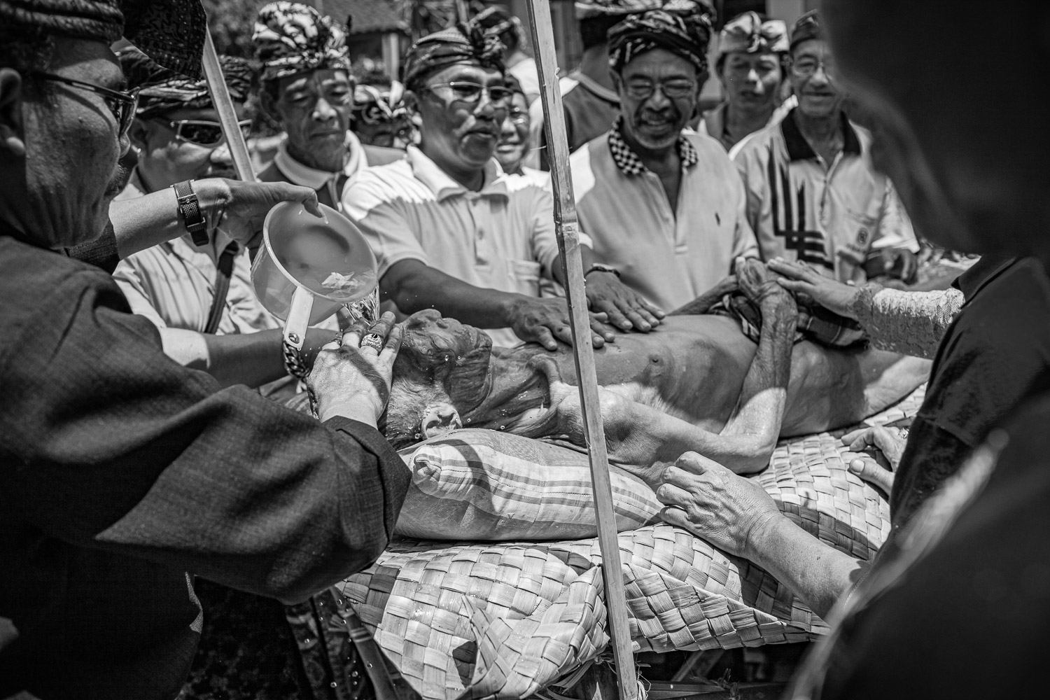 Ngaben cremation in Bali, first ritual, nyiramin layon the bathing of the corpse.
