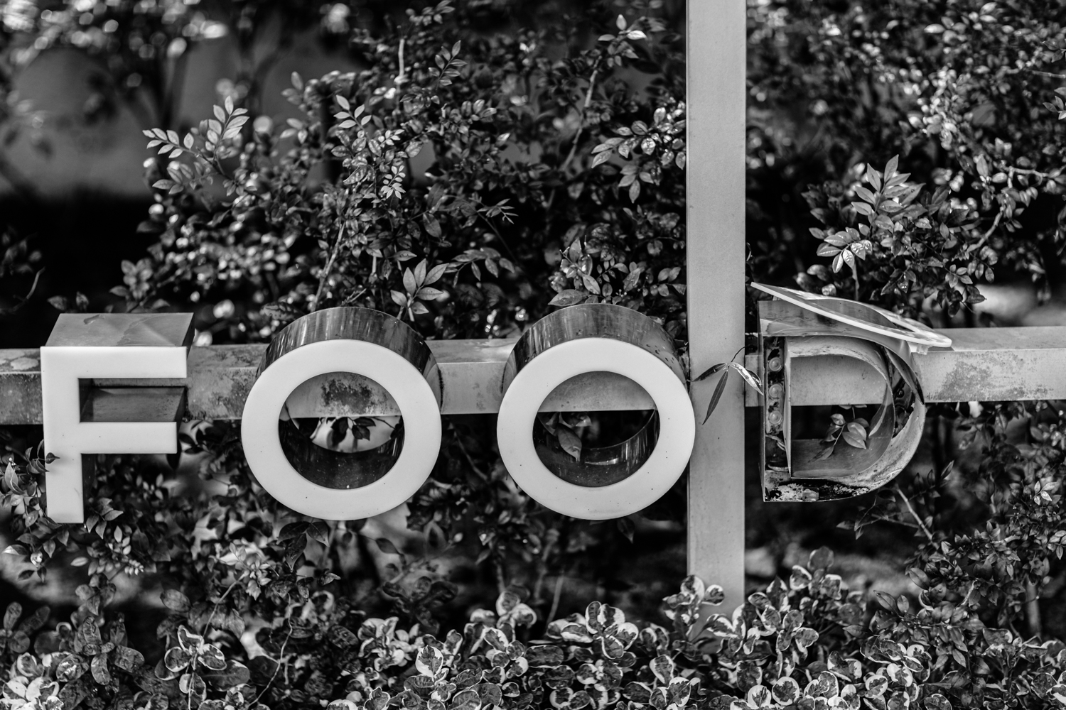 Street portrait photo in Kuala Lumpur series - broken signage 'food'.