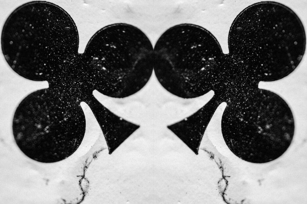 Series distressed playing cards. Black and white photograph of the 2 of Spades playing card.