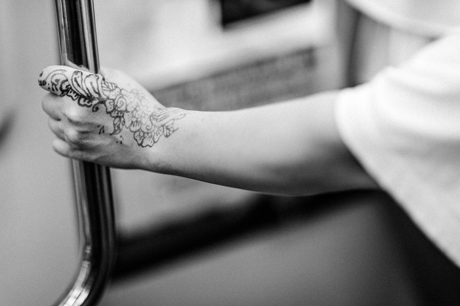 Train station photography, woman with a henna tattoo on her hand in Kuala Lumpur, Malaysia