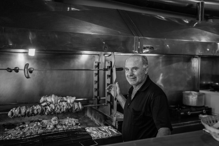 Portrait of man beside kebab machine in Athens