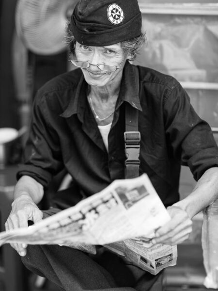 Portrait man reading newspaper in Chinatown - Kuala Lumpur - Malaysia