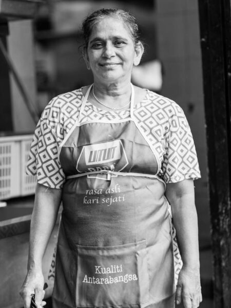 Portrait street black and white photo of a woman in Brickfields KL