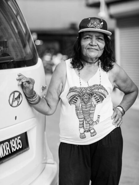 Portrait lending on a van in Brickfields Kuala Lumpur