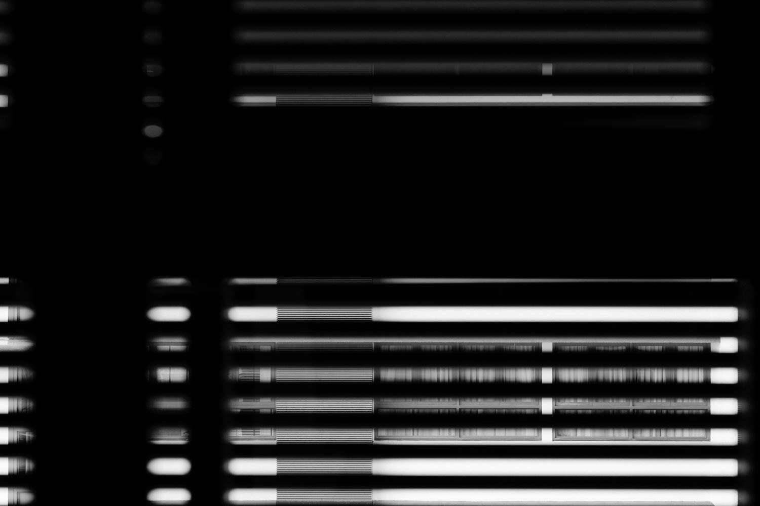 Isolation art black and white photo taken of neighbours apartment with their drapes closed.