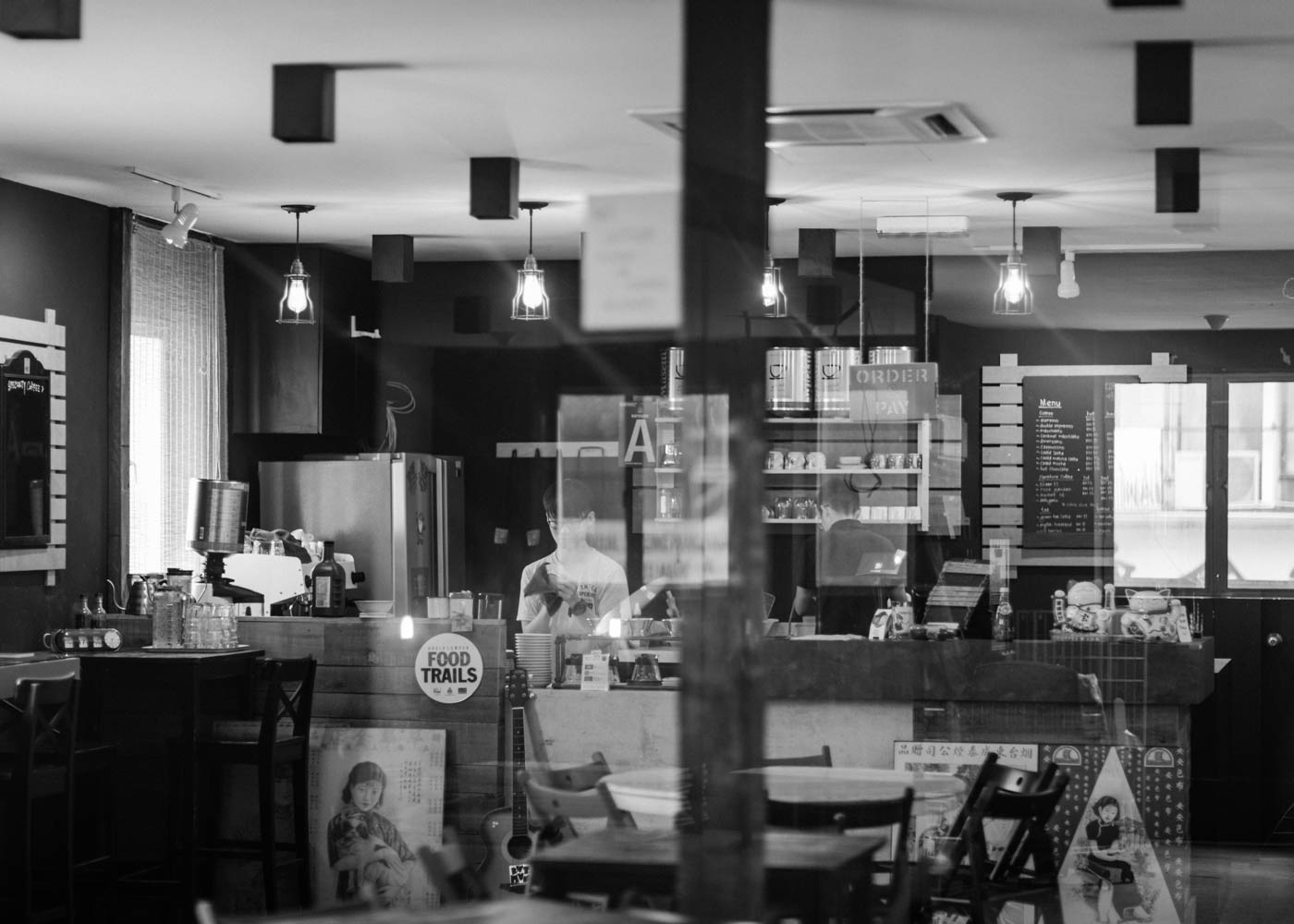 Barista cleaning coffee cups in a cafe in Pasar Seni, Kuala Lumpur - Malaysia