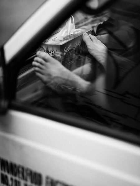 Bare feet resting on a van dashboard in Pasar Seni, Kuala Lumpur - Malaysia