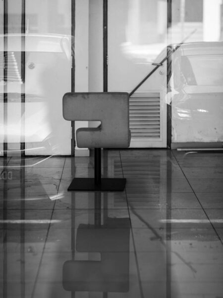 Lone chair left in a showroom undergoing a refurbishment. Street photography in black and white - Taman Tun Dr Ismail [TTDI] Kuala Lumpur - Malaysia