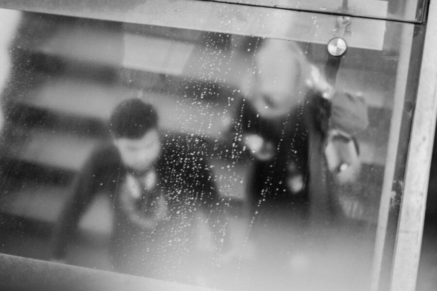 Couple sheltering from the rain in Little India, Brickfields, Kuala Lumpur – Malaysia