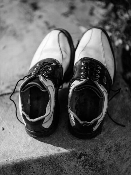 Pair of black and white shoes with laces - Little India, Brickfields, Kuala Lumpur – Malaysia