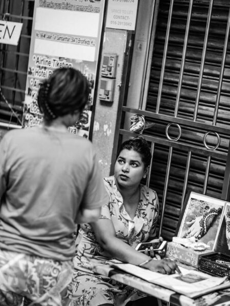 Woman selling henna tattoo designs in Little India, Brickfields, Kuala Lumpur – Malaysia