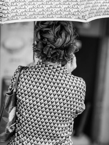 Woman holding umbrella with patterned blouse in Pasar Seni, Kuala Lumpur – Malaysia