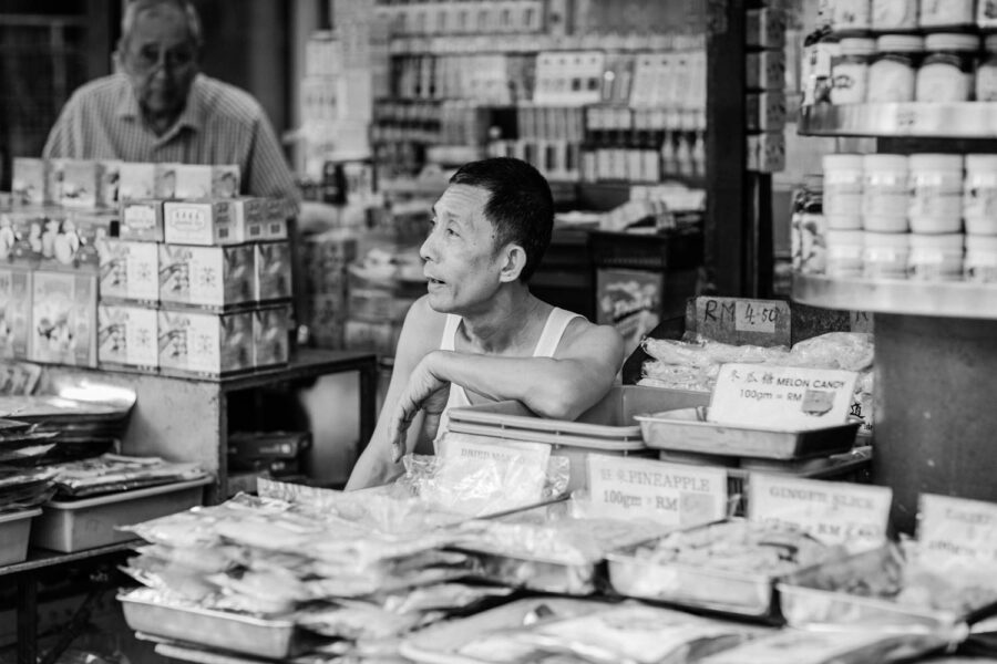 Petaling Street hawker shop in Chinatown - Kuala Lumpur - Malaysia. This store sells melon candy and pineapple pieces.