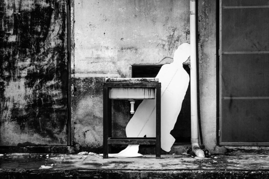 White cut out shape of a man leaning against a wall at the back of a restaurant in TTDI - KL - Malaysia