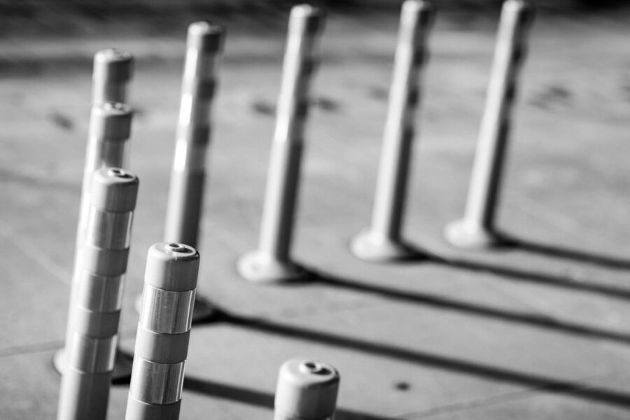 Traffic barriers with strong shadows black and white photo