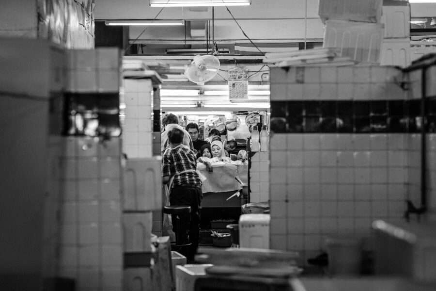 TTDI wet market fishmonger serving customers - KL - Malaysia