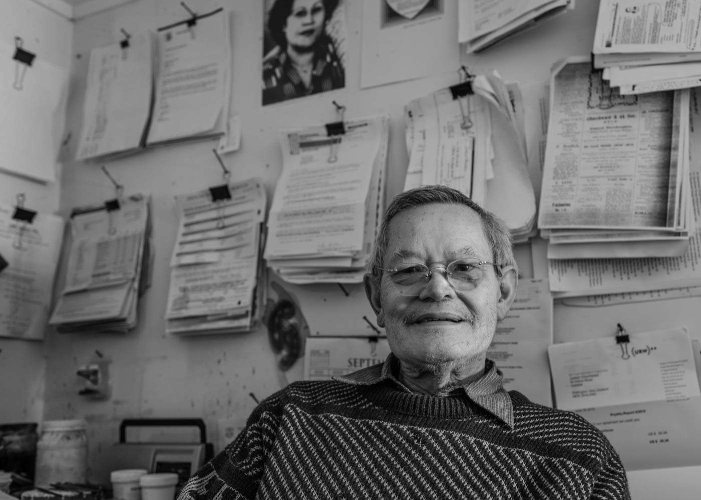 Joseph Churchward in his studio amongst his paper wall filing system.