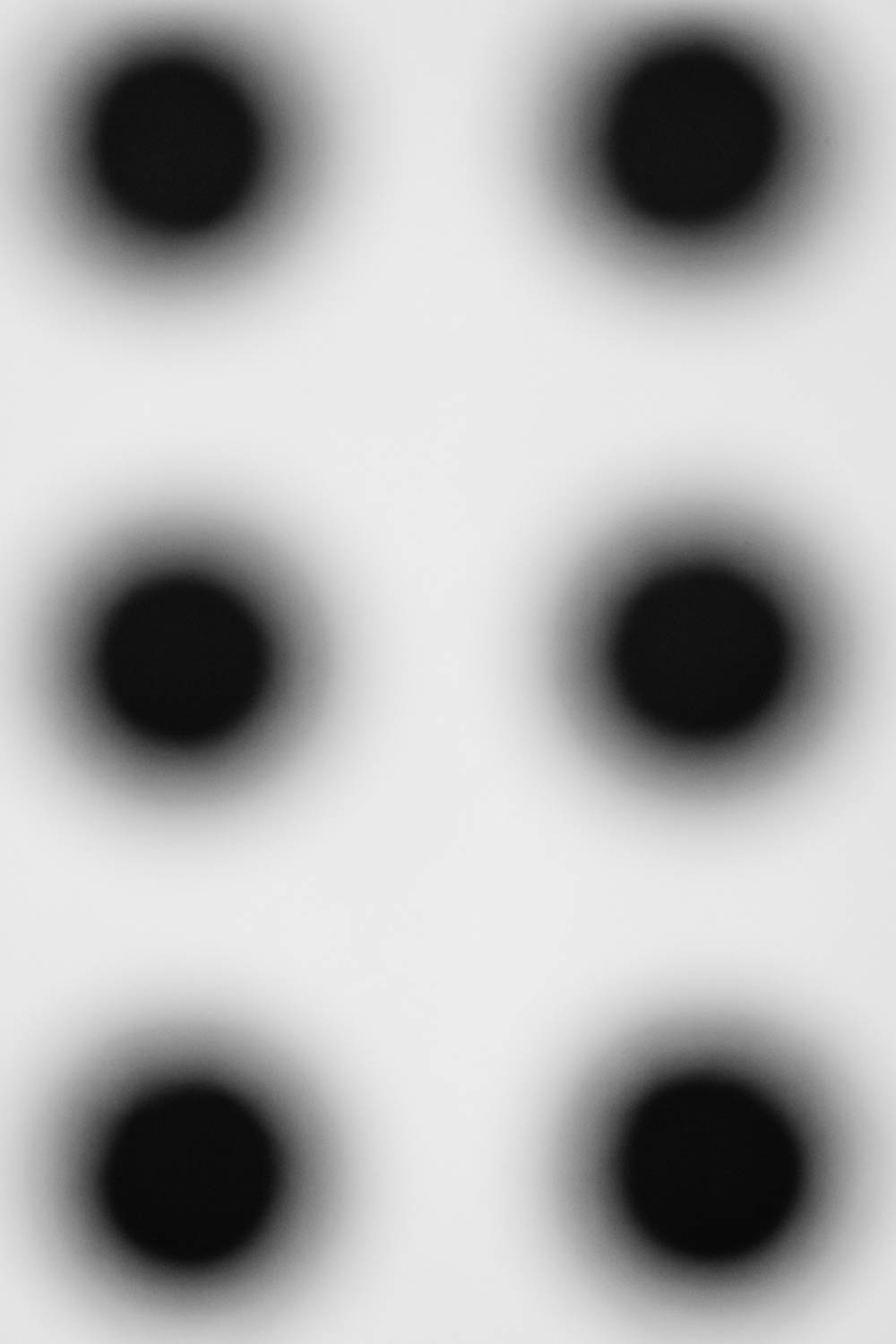 Six black circles artwork.