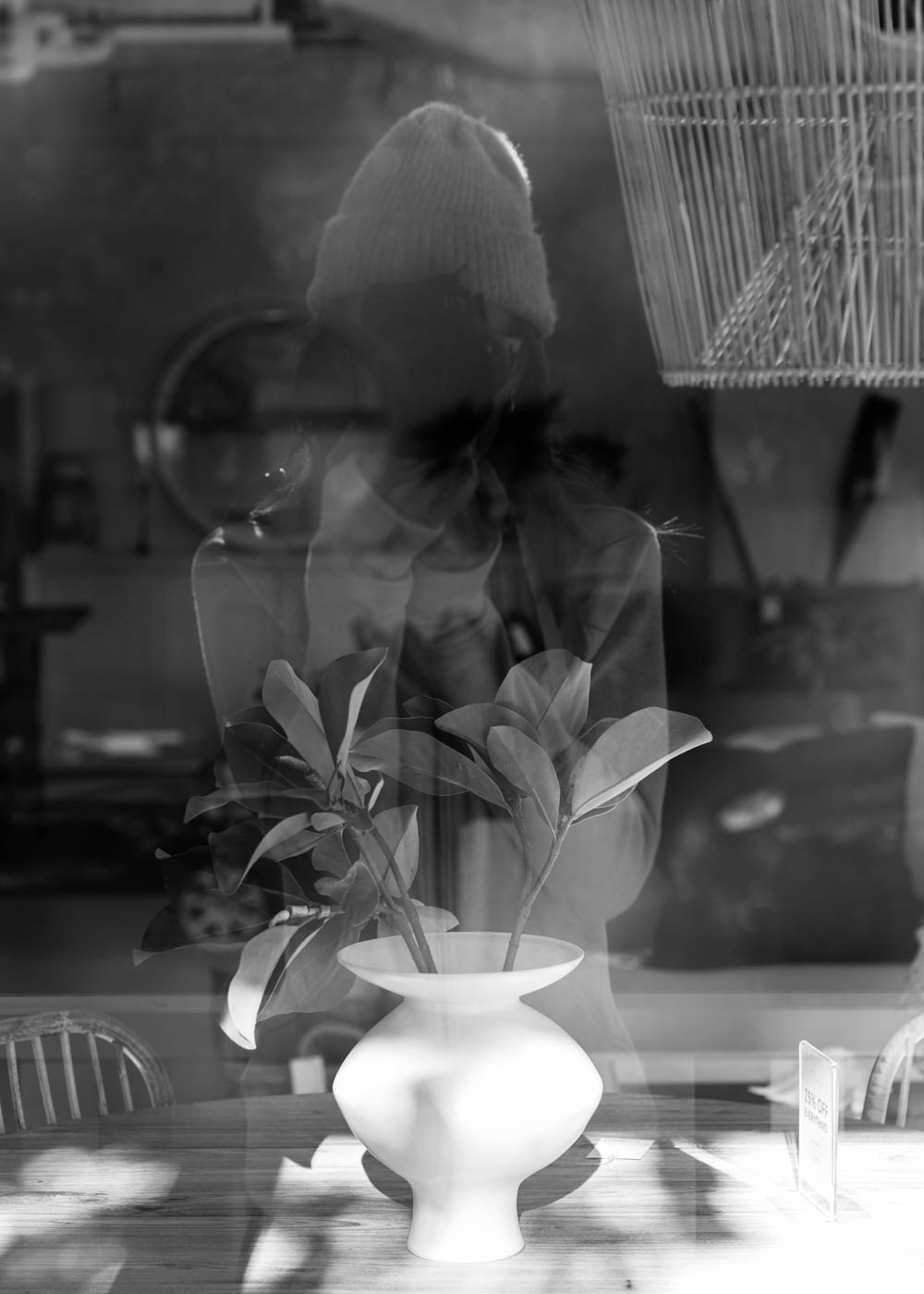 Self portrait reflection from The Beach Furniture shop front window.