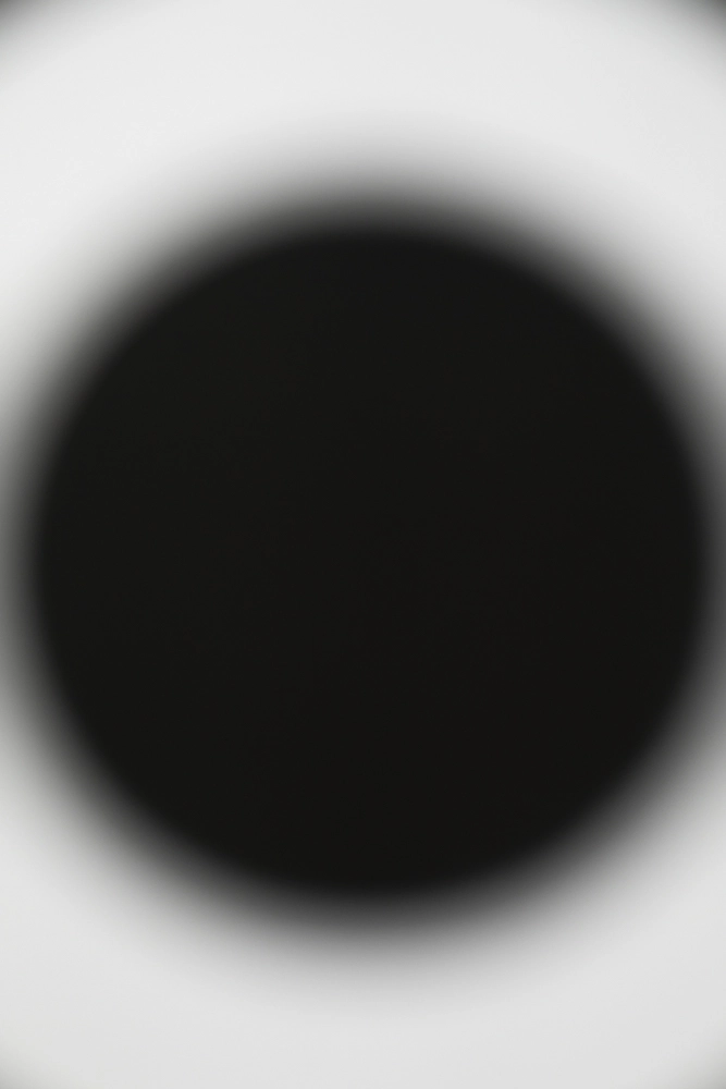 Large black circle.