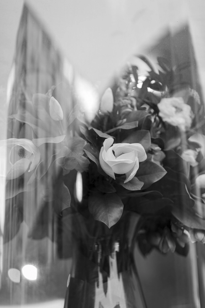 Magnolia silk flowers in a vase.