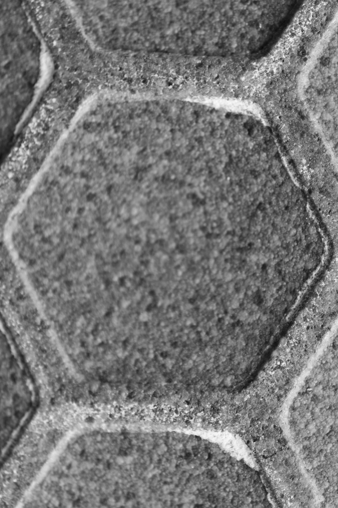 Hexagon pattern on a concrete floor tile.