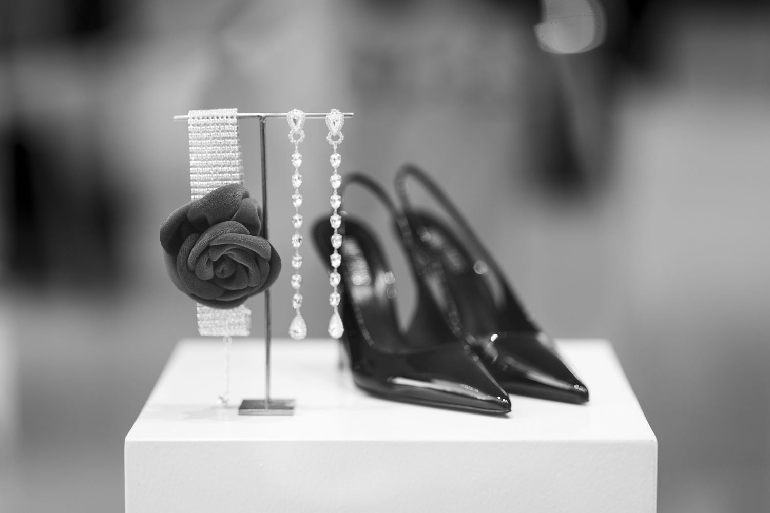 Velvet rose choker, slingback shoes and long crystal earrings.