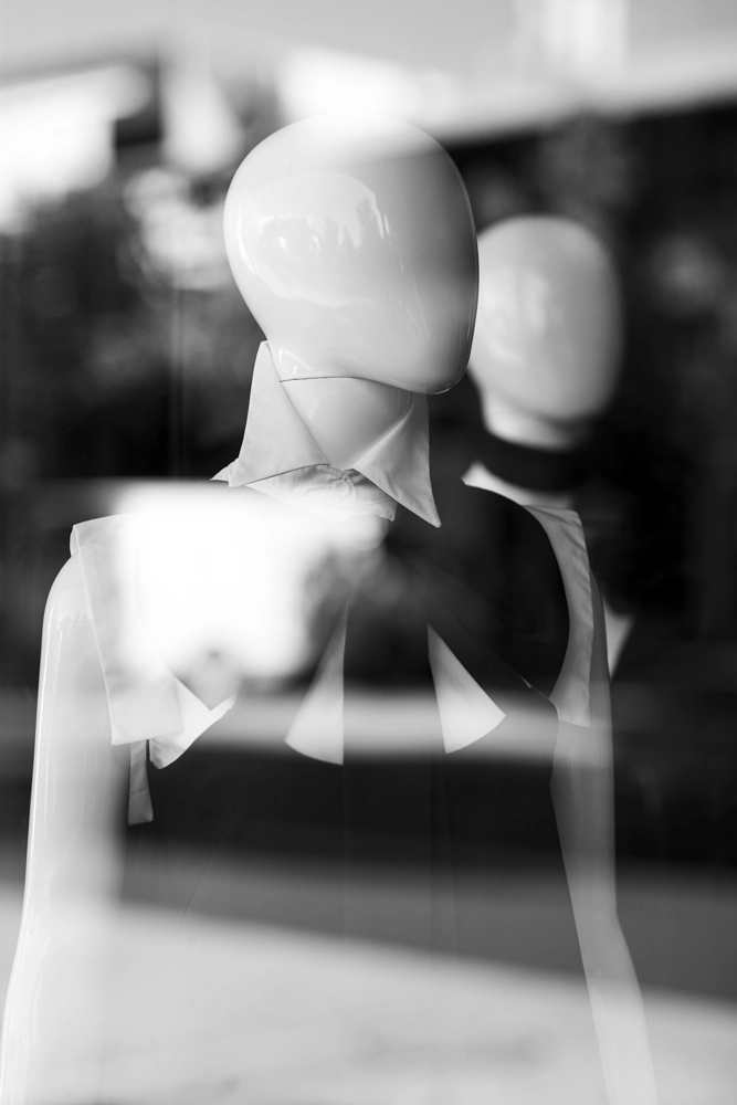A shop mannequin styled with a black Cupid bow top.