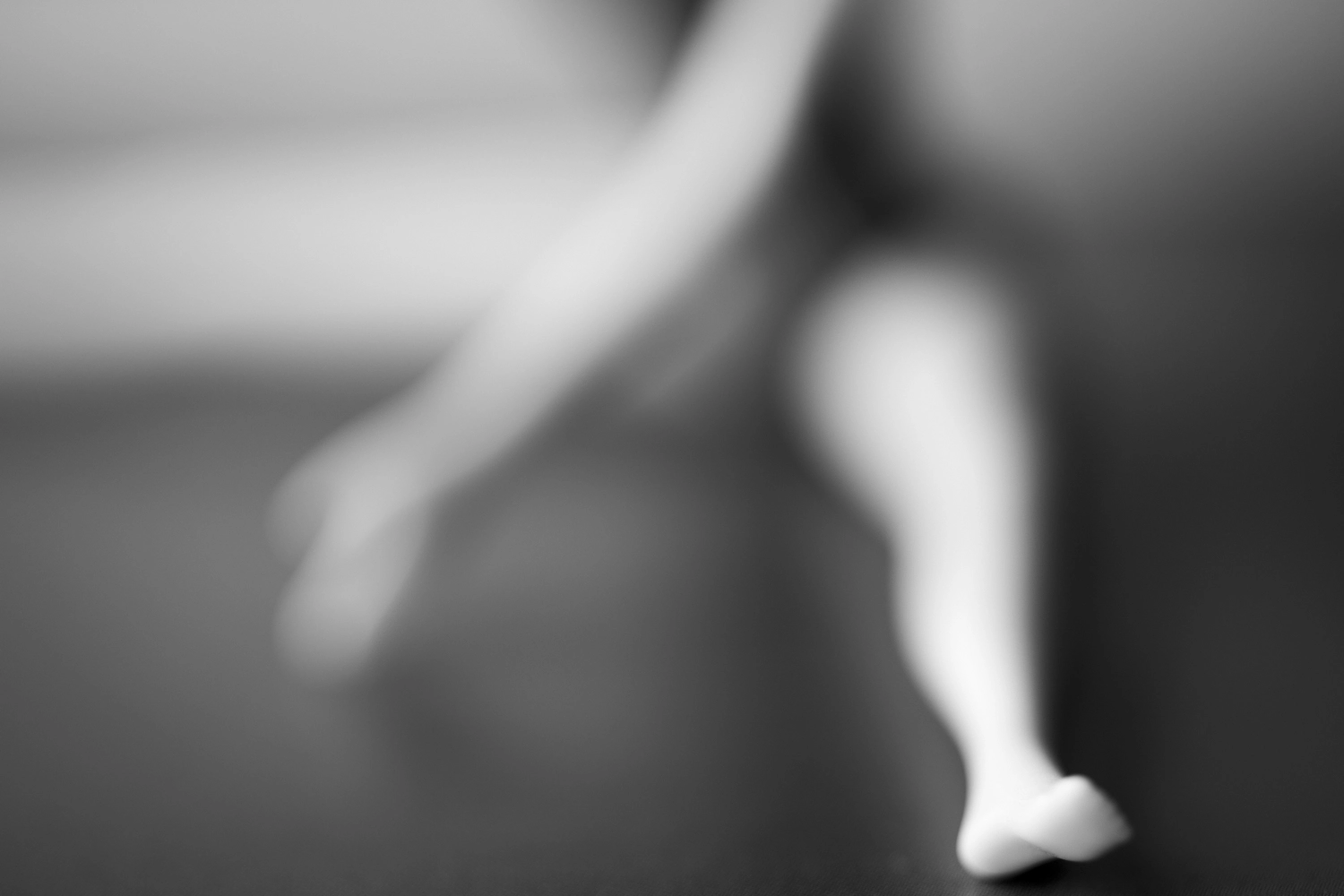 Mysterious doll yoga pose photograph.