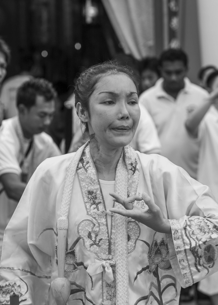 A spirit medium uses mudras for energy flow to help her spiritual well-being.
