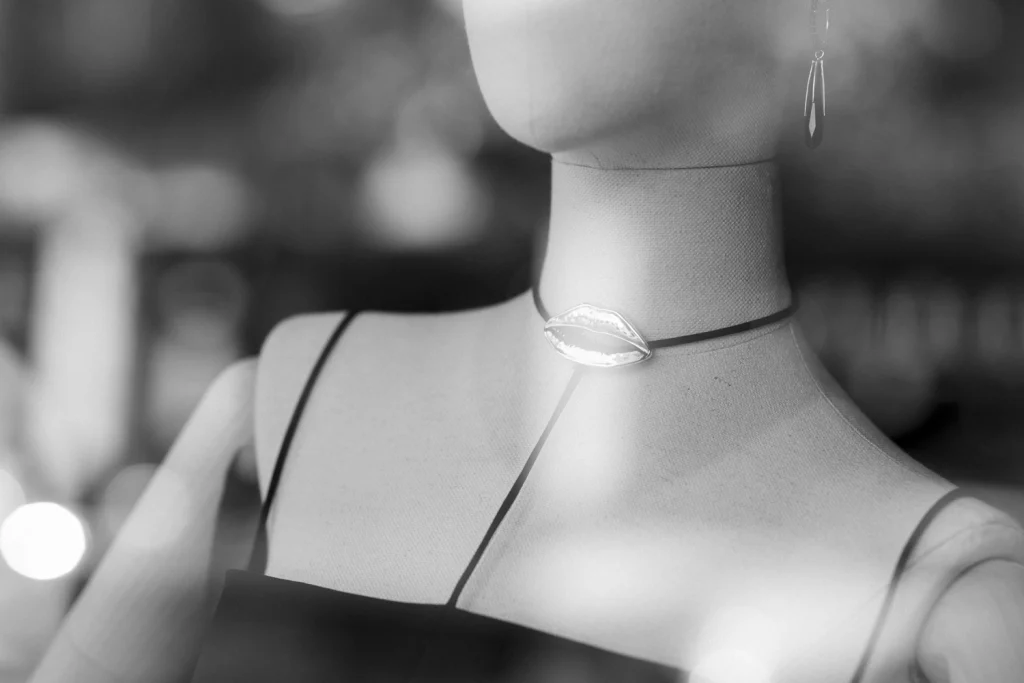 Shop mannequin wearing a lips necklace