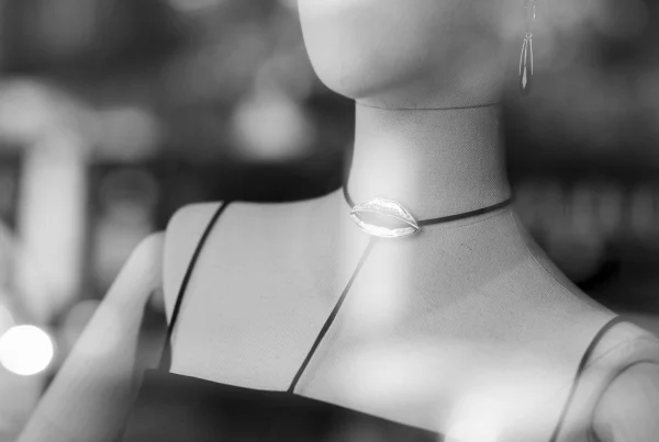 Shop mannequin wearing a lips necklace