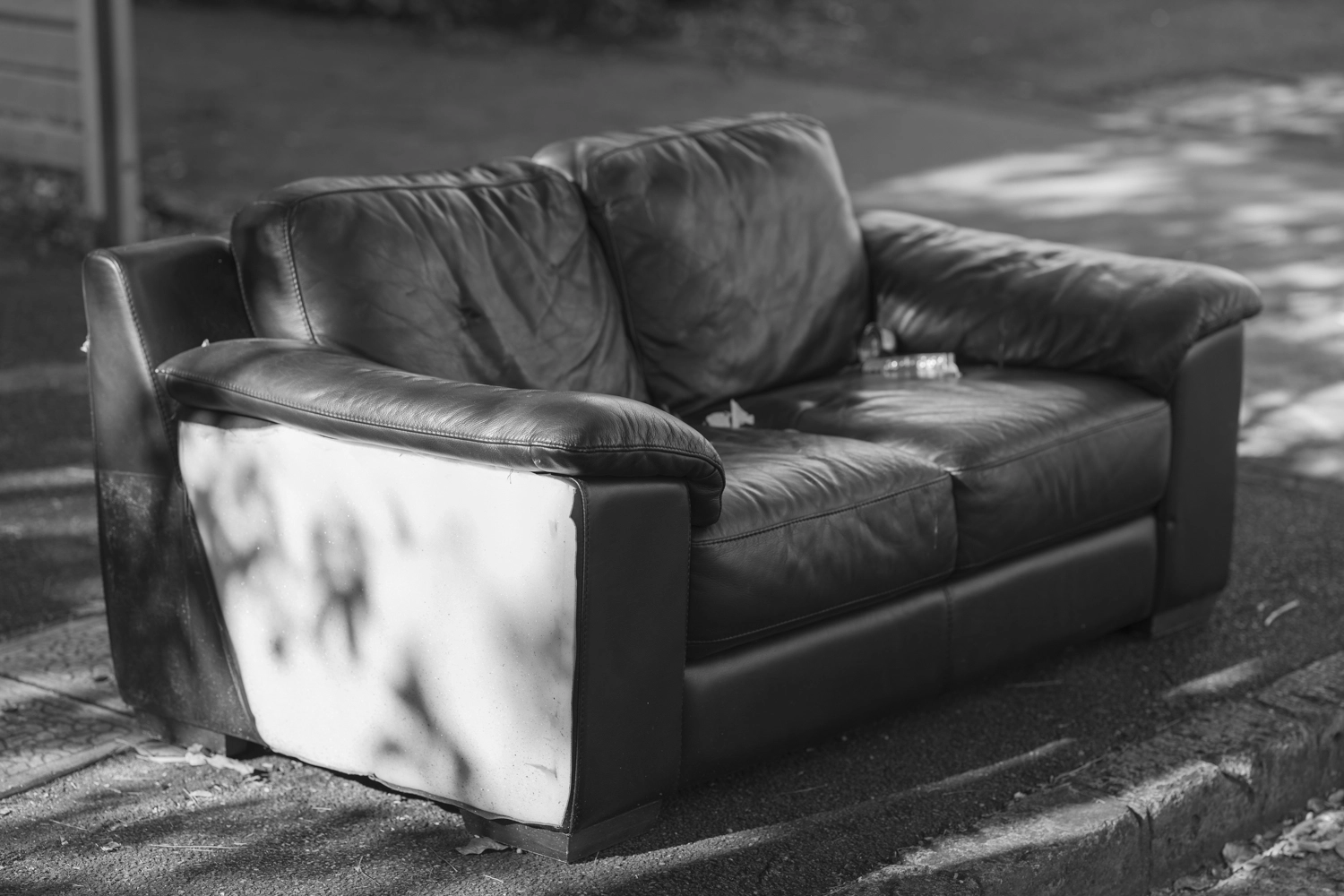 Newstead street photography - an abandoned sofa left on the sidewalk.