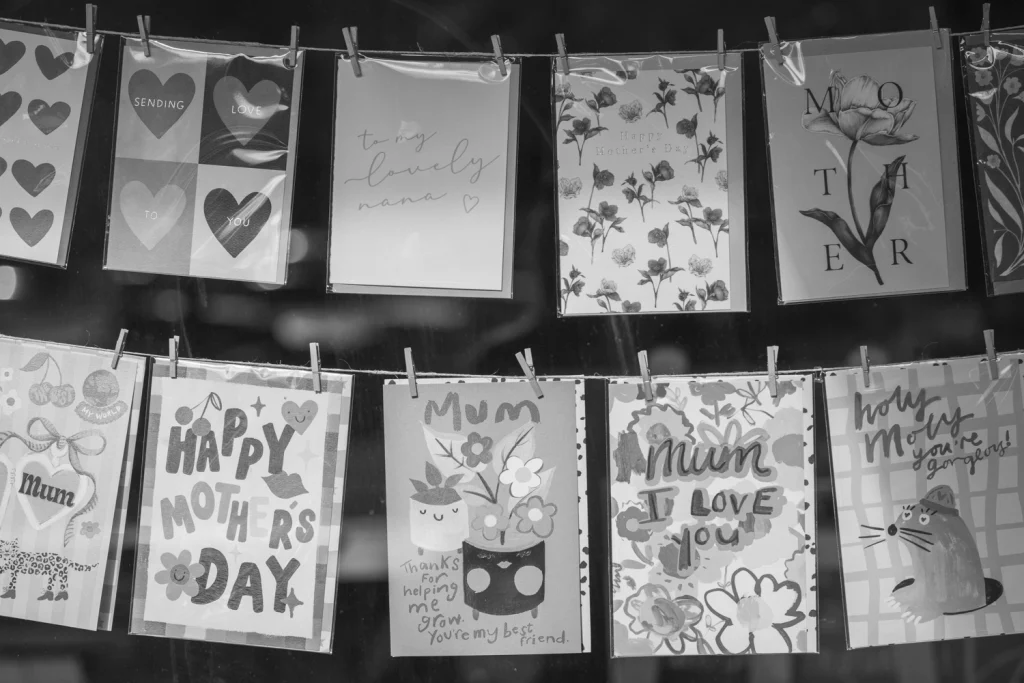 Mother’s Day cards and heart motifs displayed in a Newstead shopfront.
